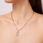 Load image into Gallery viewer, Gold chain necklace with a silver diamond pendant on a model neck