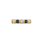 Load image into Gallery viewer, Gold ring with alternating blue and clear gemstones on a white background