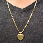 Load image into Gallery viewer, 18k yellow gold necklace with a detailed shield-shaped back pendant on model