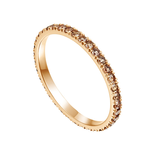 Rose gold ring with small diamonds on a white background