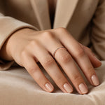 Load image into Gallery viewer, Rose gold ring with small diamonds on a model hand