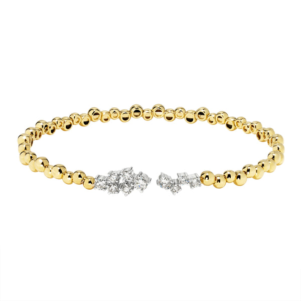 Gold bracelet with diamond accents on a white background