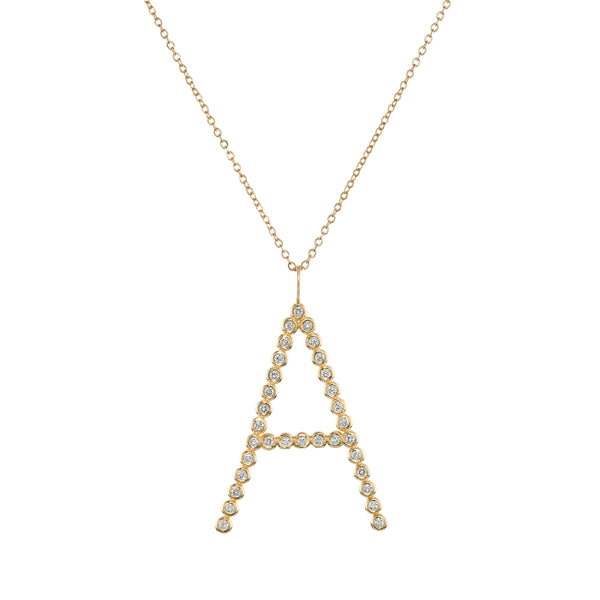 Gold necklace with a letter 'A' pendant on a white background