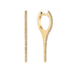 Load image into Gallery viewer, A pair of 14kt gold huggy earrings with a sleek icicle point design, featuring small diamonds set along the length of each earring.