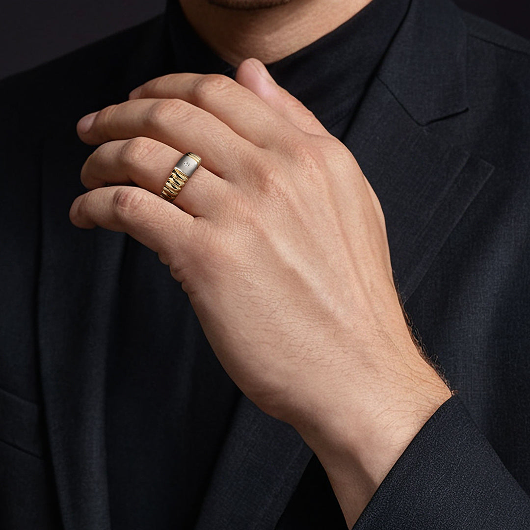 Gold and silver ring with a diamond on a male model hand