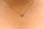 Load image into Gallery viewer, Gold necklace with a pink gemstone on a person's neck