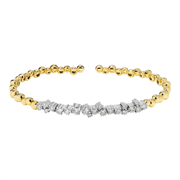 Gold and silver bracelet with diamond accents on a white background