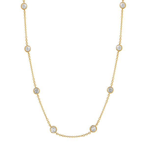 Gold necklace with small diamonds on a white background