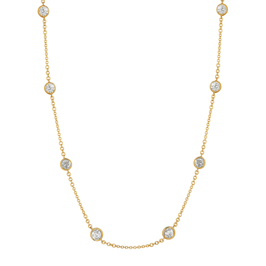 Gold necklace with small diamonds on a white background