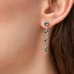 Load image into Gallery viewer, Pair of green gemstone dangle earrings on a model