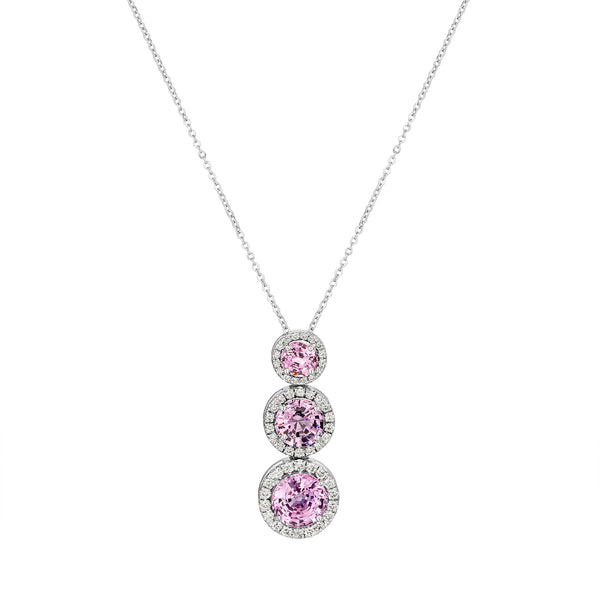 Necklace with three pink gemstones on a white background