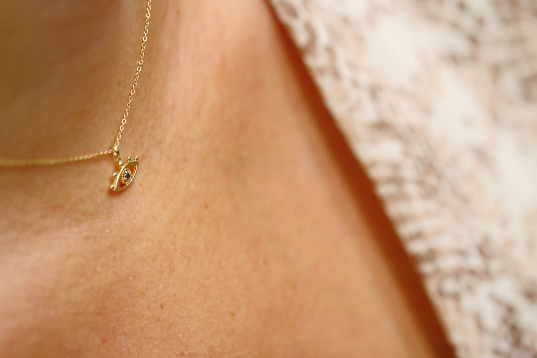 Gold Evil Eye Necklace on Model Neck