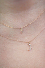 Load image into Gallery viewer, Gold necklace with a mini crescent moon and regular crescent moon pendant on model neck