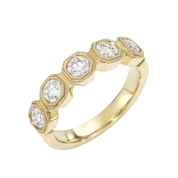 Gold octagon setting ring with five diamonds on a white background