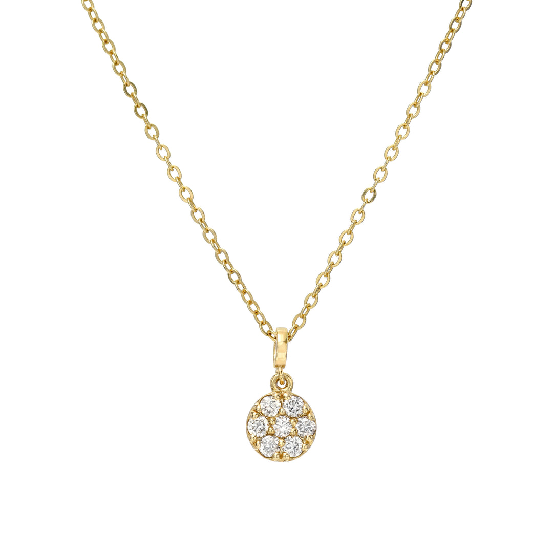 Gold necklace with a circle diamond pendant on a white background