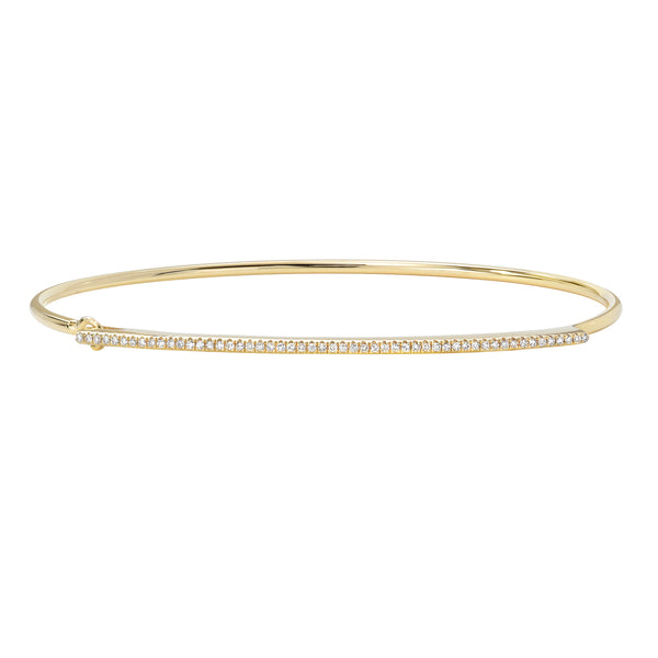 Gold bracelet with small diamonds on a white background
